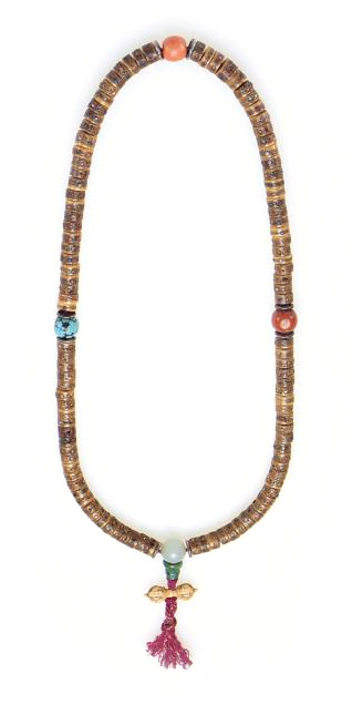 Tibetan Buddhist mala composed of 108 disk-shaped beads of human bone