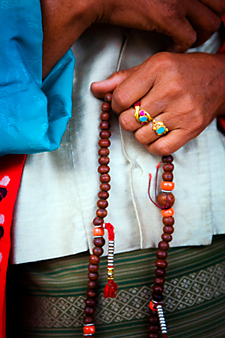 Tibetan woman with Buddhist prayer beads