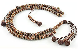 Muslim prayer beads (subha) of walnut inlaid with sterling silver
